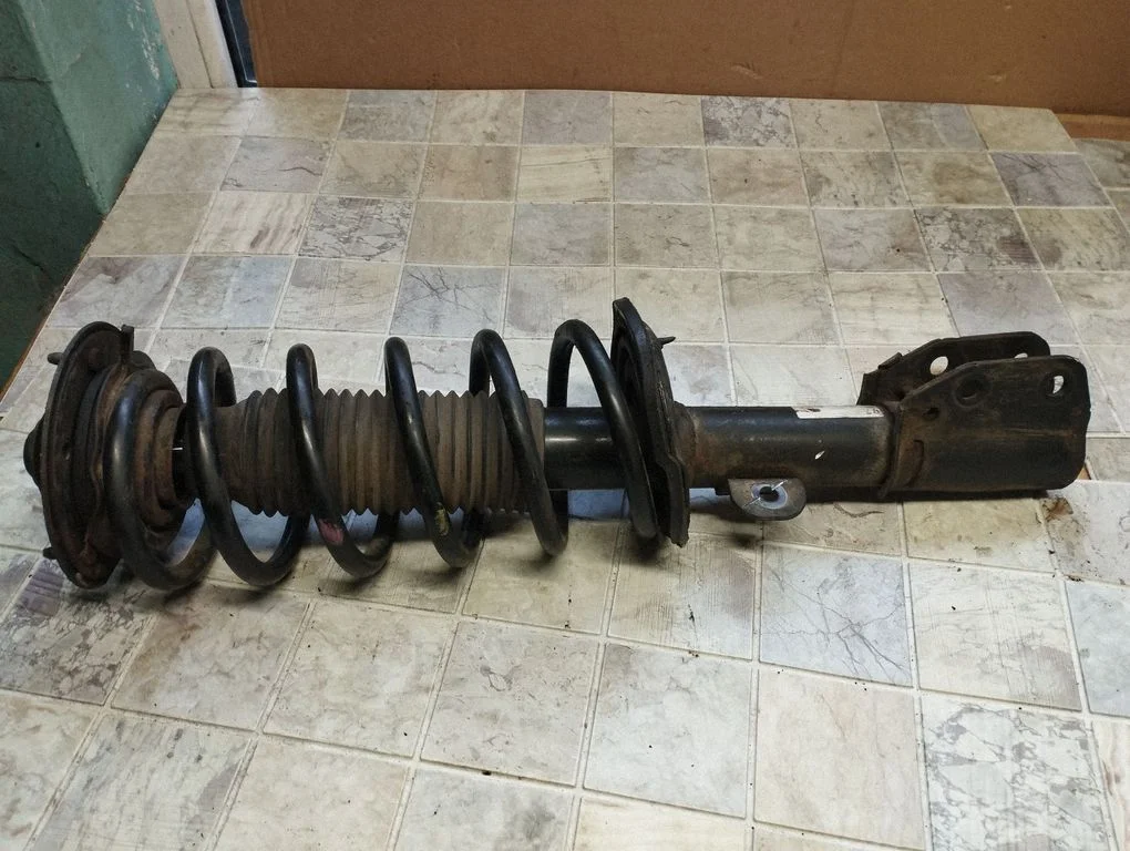 Front shock absorber with coil spring – front right