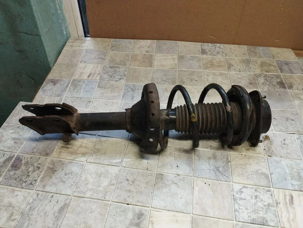 Front shock absorber with coil spring – front right
