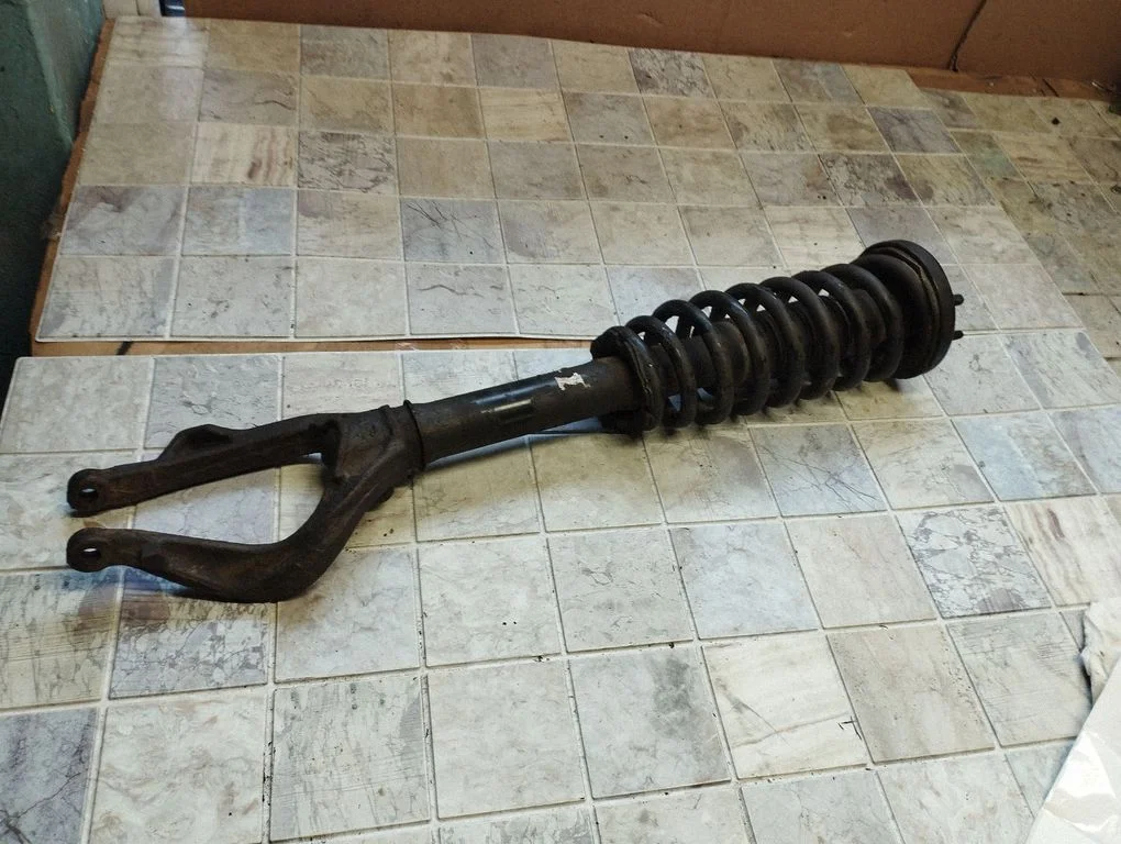 Front shock absorber with coil spring – front right