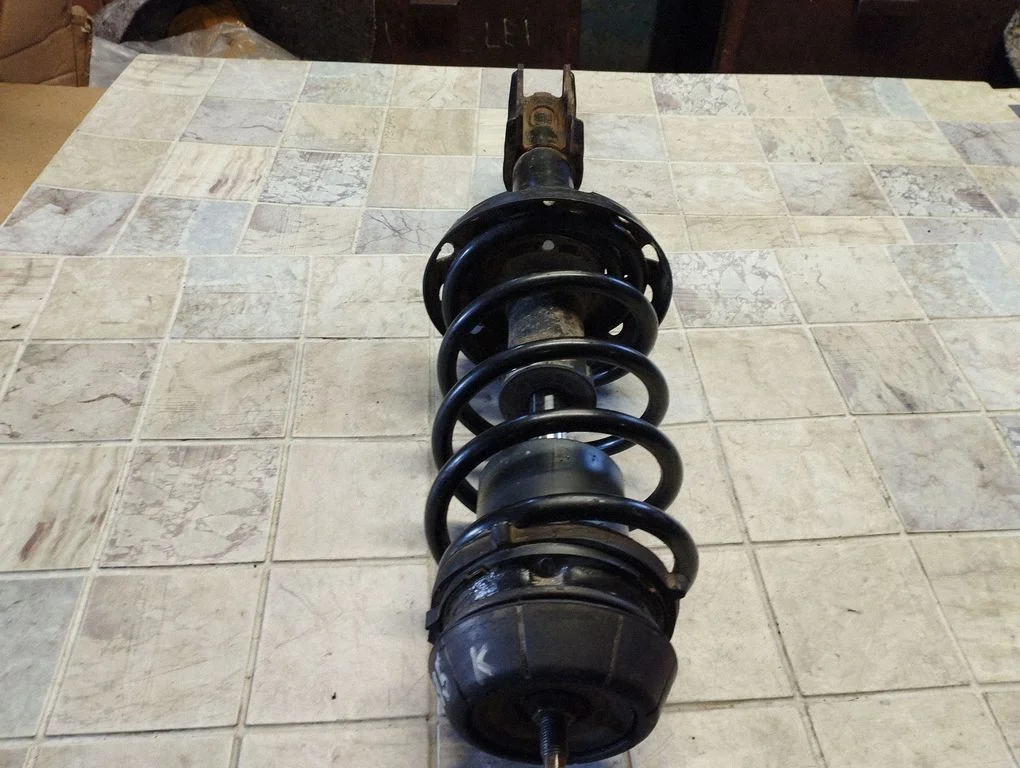 Front shock absorber with coil spring 024443321