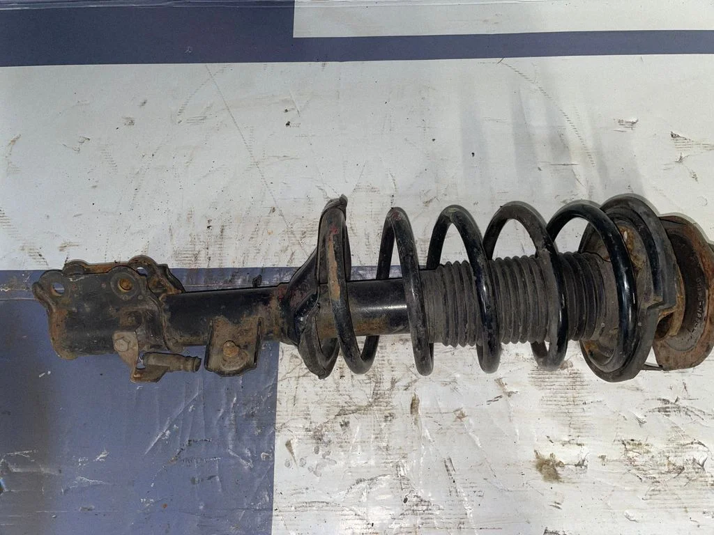 Front shock absorber with coil spring – front right