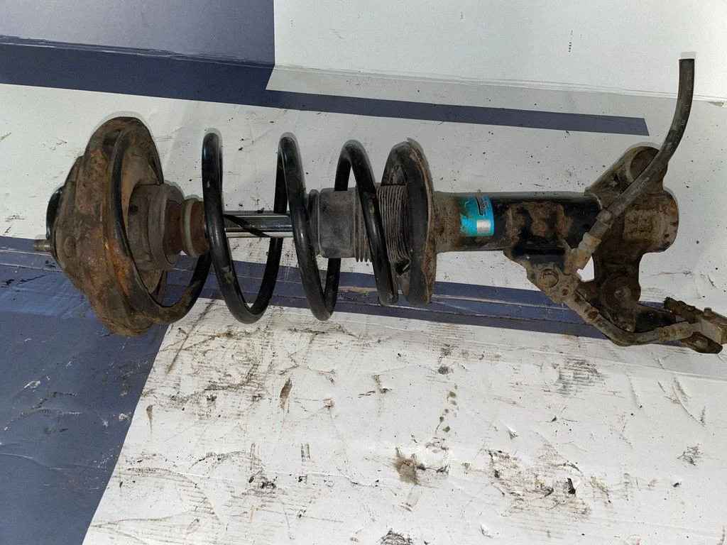 Front shock absorber with coil spring – front right