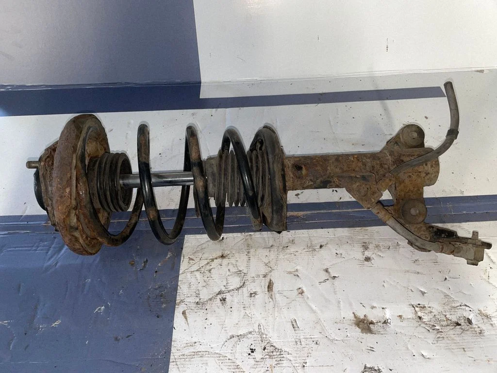 Front shock absorber with coil spring – front right