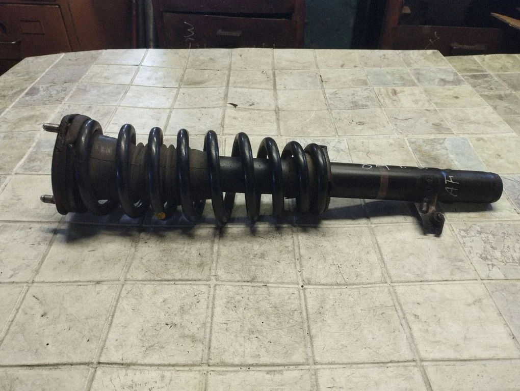 Front shock absorber with coil spring – front right