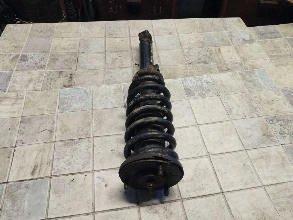 Front shock absorber with coil spring – front right