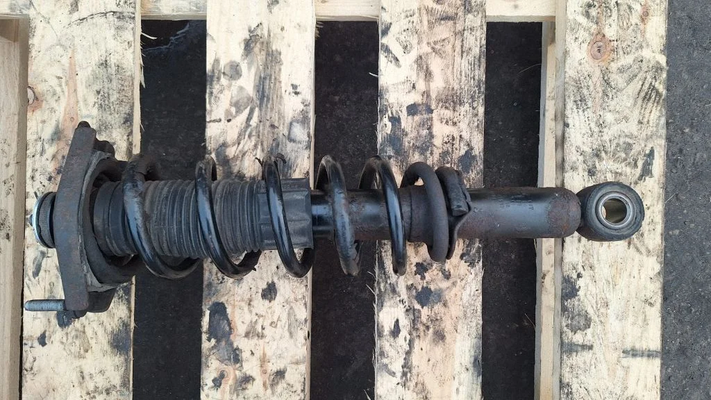 Rear shock absorber with coil spring – rear left
