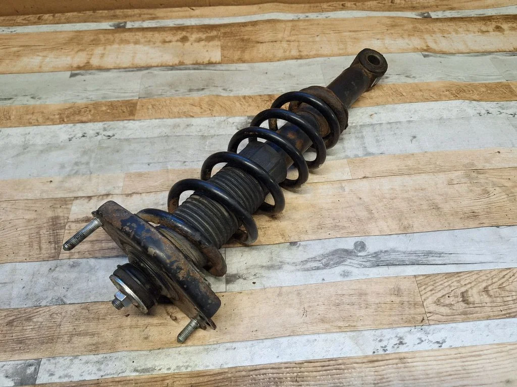 Rear shock absorber with coil spring – front left