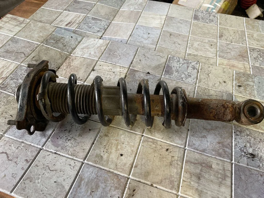 Rear shock absorber with coil spring – rear right