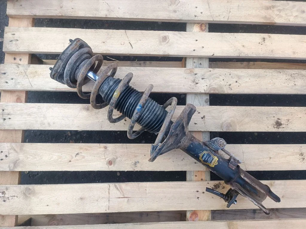 Rear shock absorber with coil spring – rear left