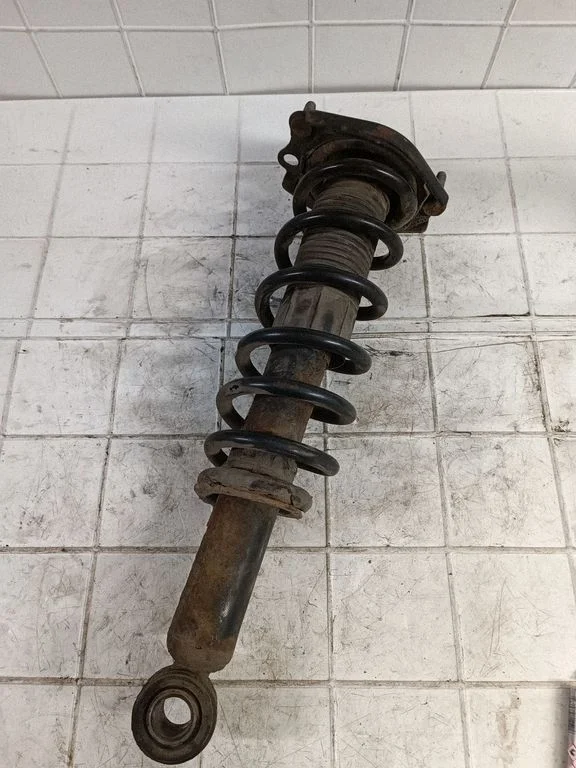 Rear shock absorber with coil spring – rear left