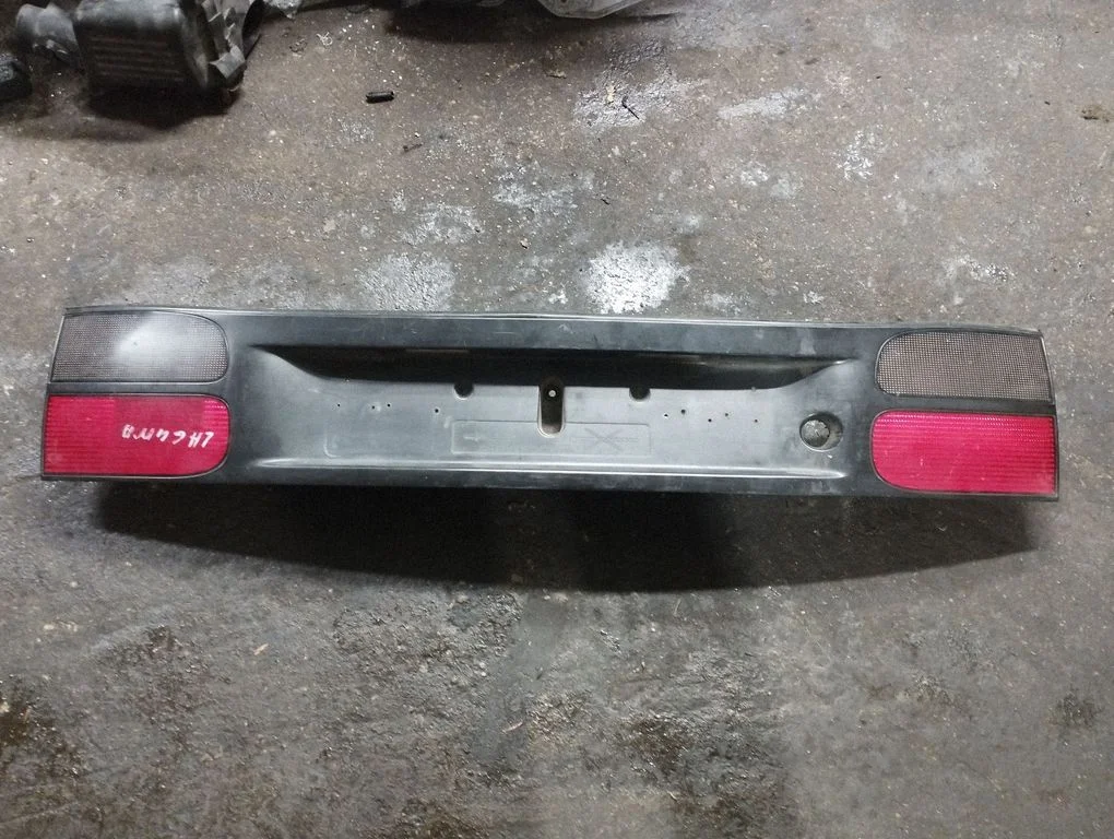 Trunk door license plate light bar 7700820049