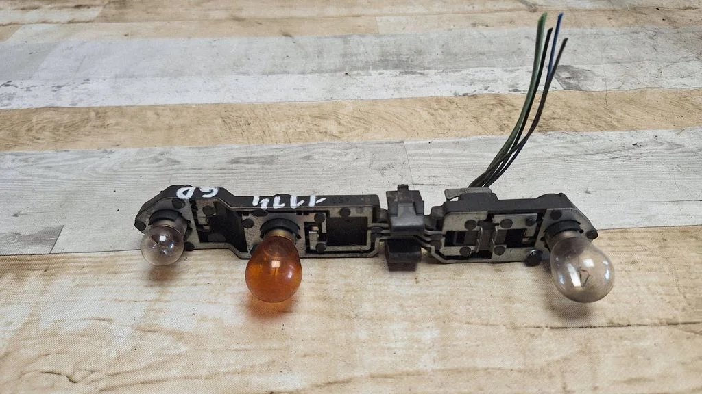 Tail light bulb cover holder – Volvo S60 (2001-2004)