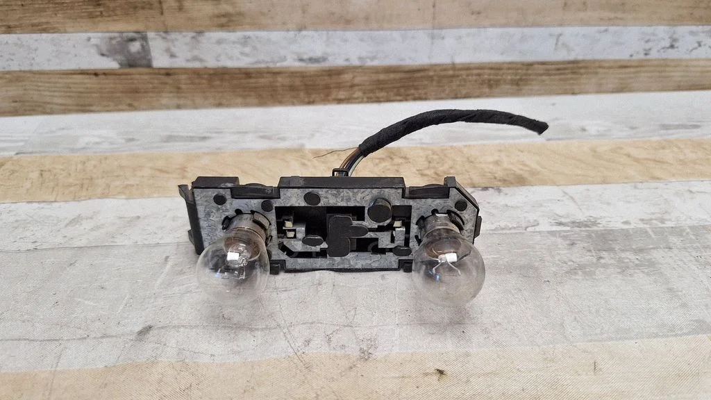 Tail light bulb cover holder 7M3945257A