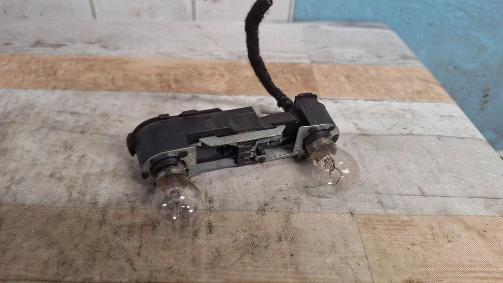 Tail light bulb cover holder 29037004