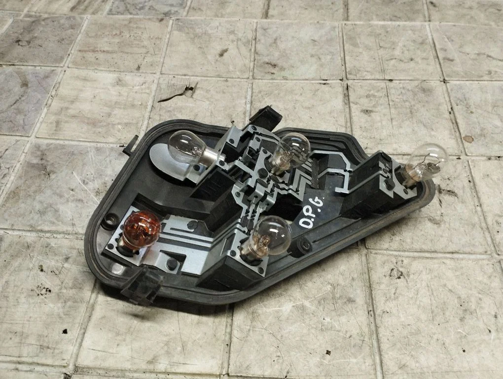Tail light bulb cover holder 159728