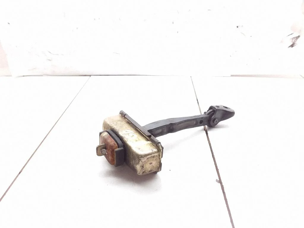 Rear door check strap stopper – rear right
