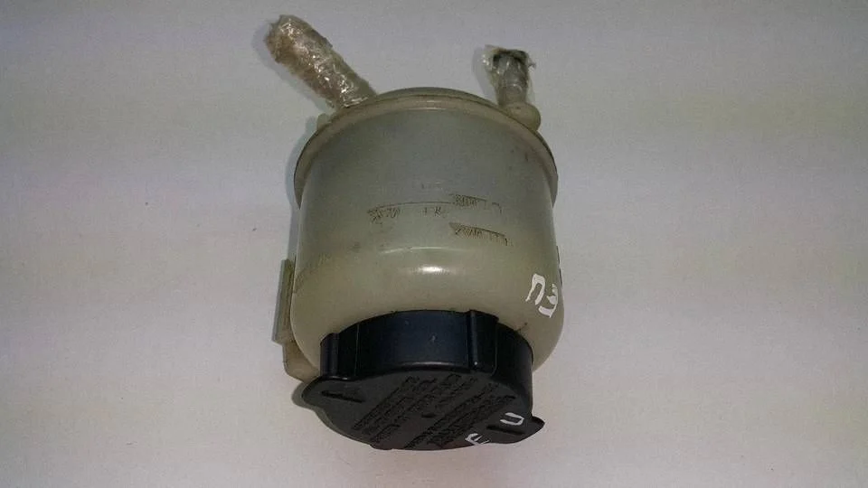 Power steering fluid tank/reservoir – front