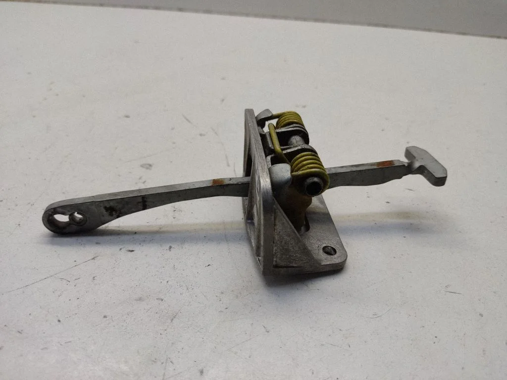 Rear door check strap stopper – left