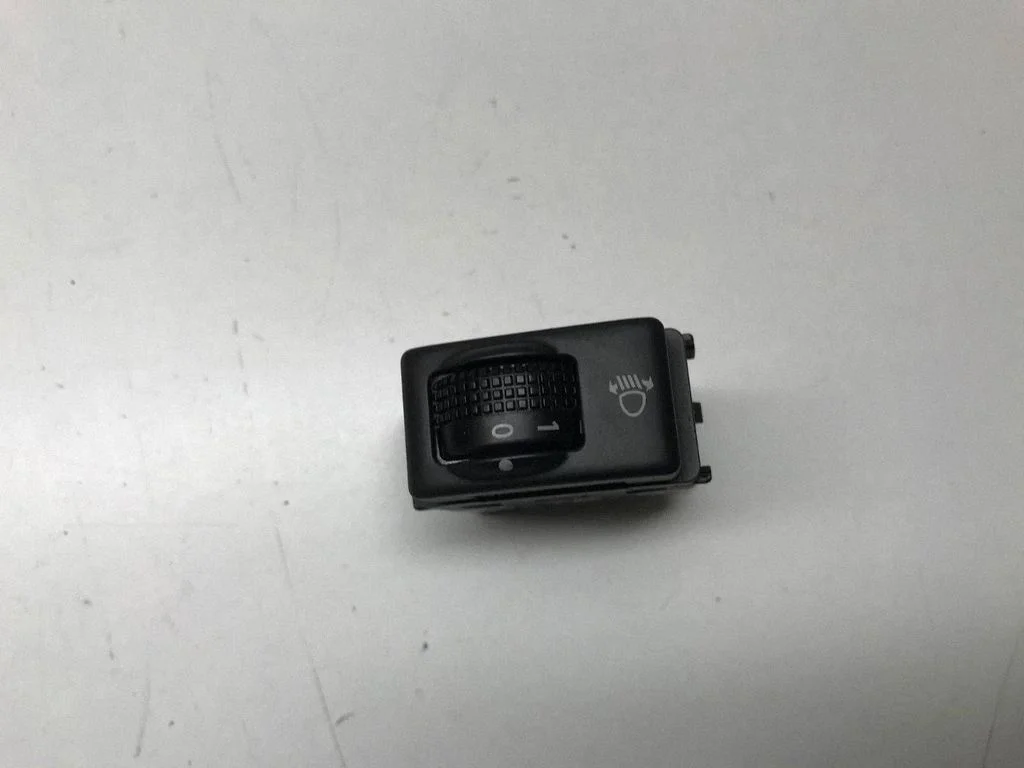 Headlight level height control switch – front