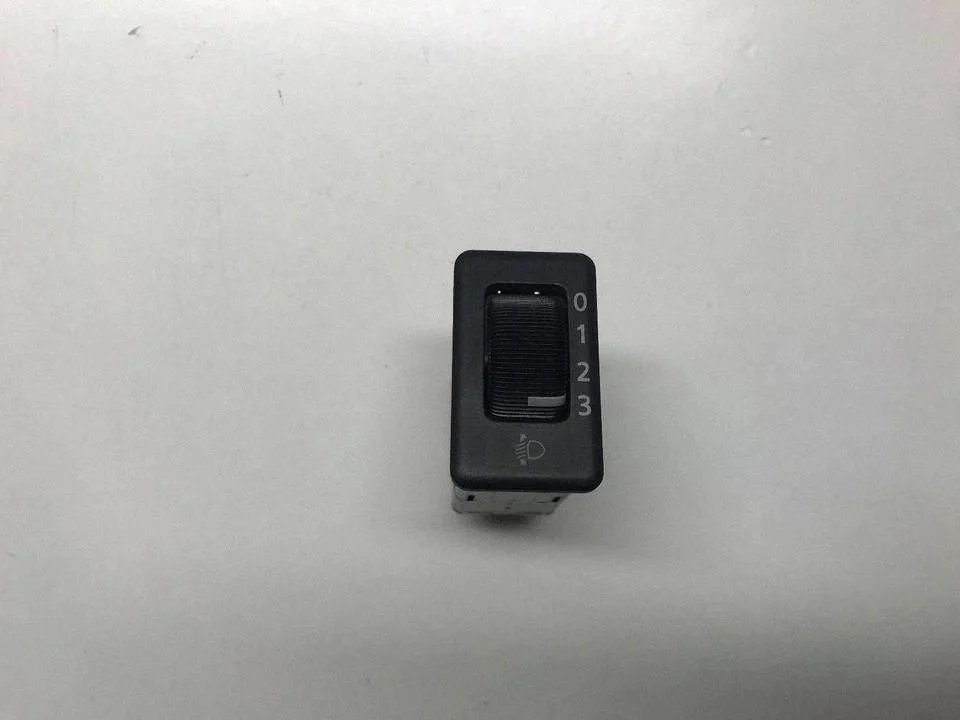 Headlight level height control switch – front