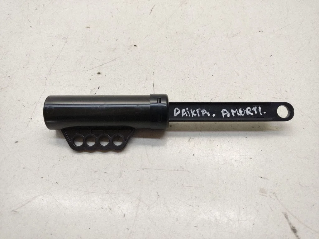 Glovebox shock absorber – front