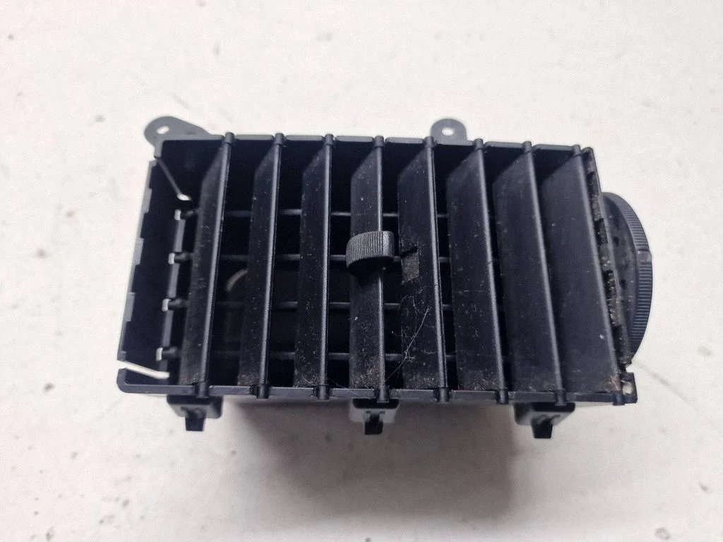 Dash center air vent grill 05028820AA