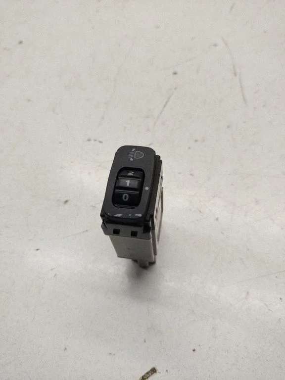 Headlight level height control switch – front