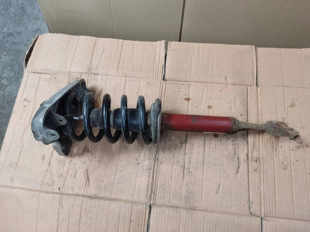 Front shock absorber with coil spring 8E0413031CA