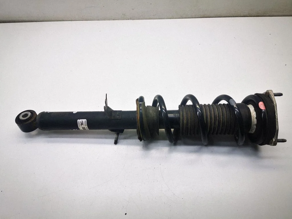 Front shock absorber with coil spring 561111EA0C