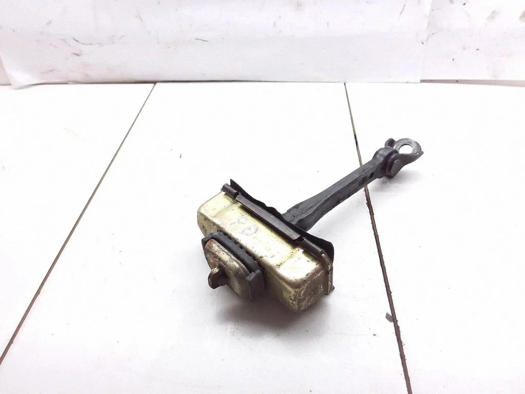 Front door check strap stopper – front right