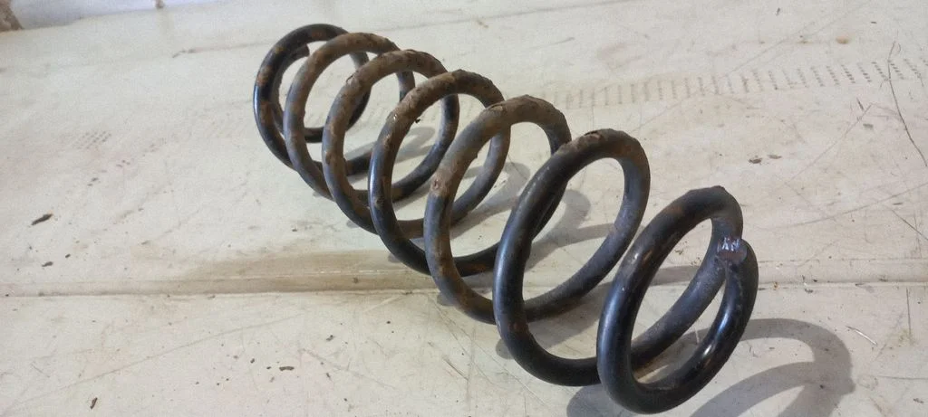Rear coil spring – rear left