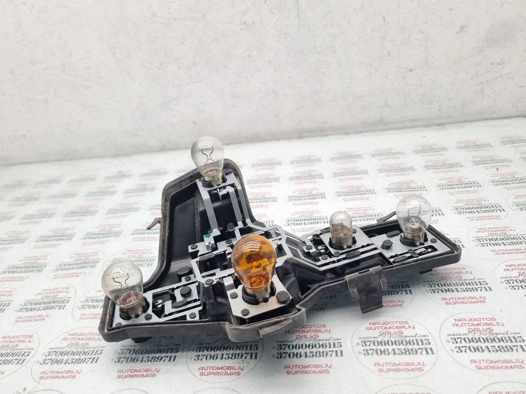 Tail light bulb cover holder 1T0945257D
