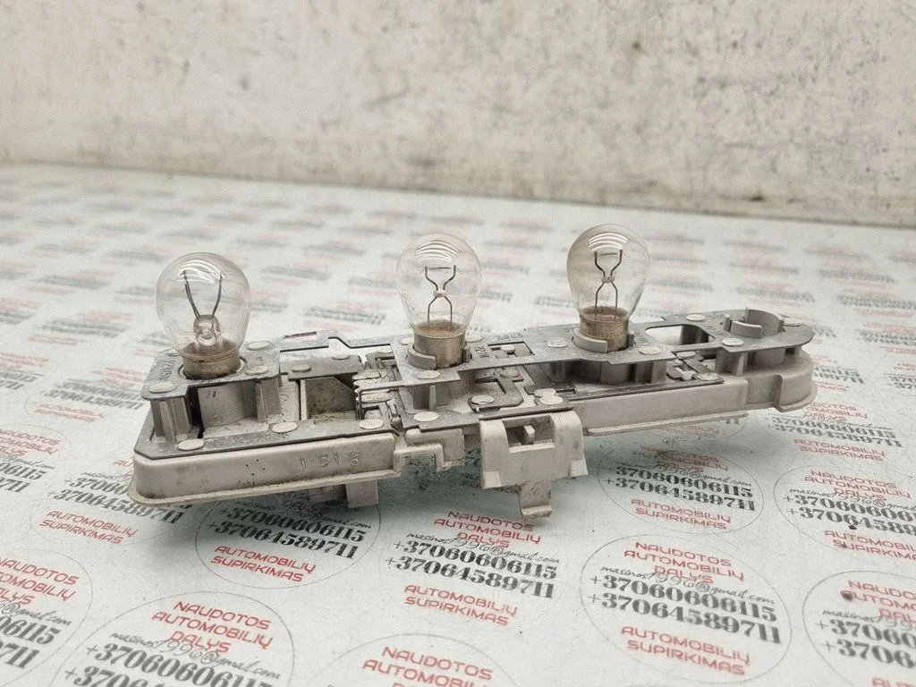 Tail light bulb cover holder 8D9945257