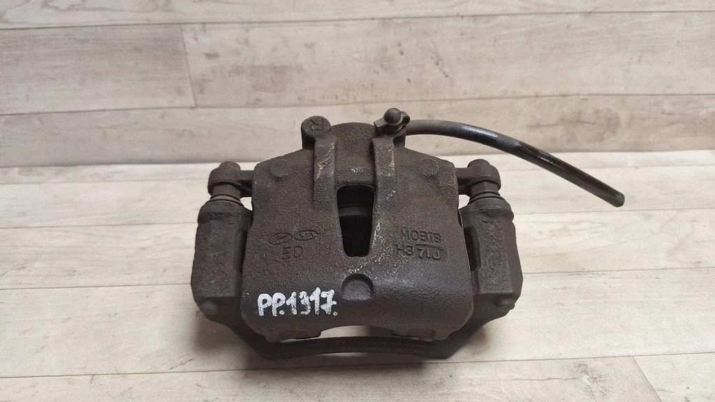 Front brake caliper – front right