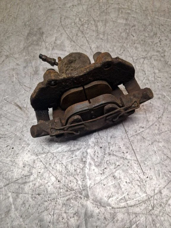 Front brake caliper – left