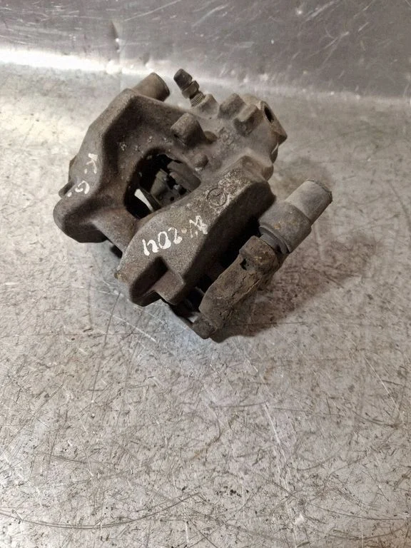Rear brake caliper – left