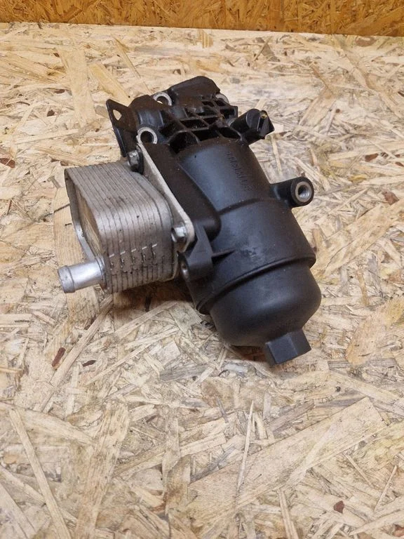 Oil filter mounting bracket 264102A300
