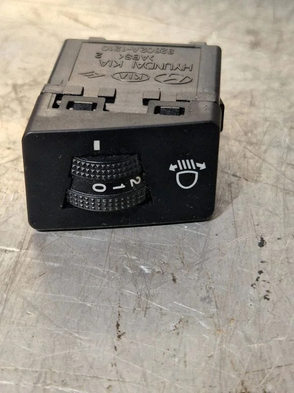 Headlight level height control switch