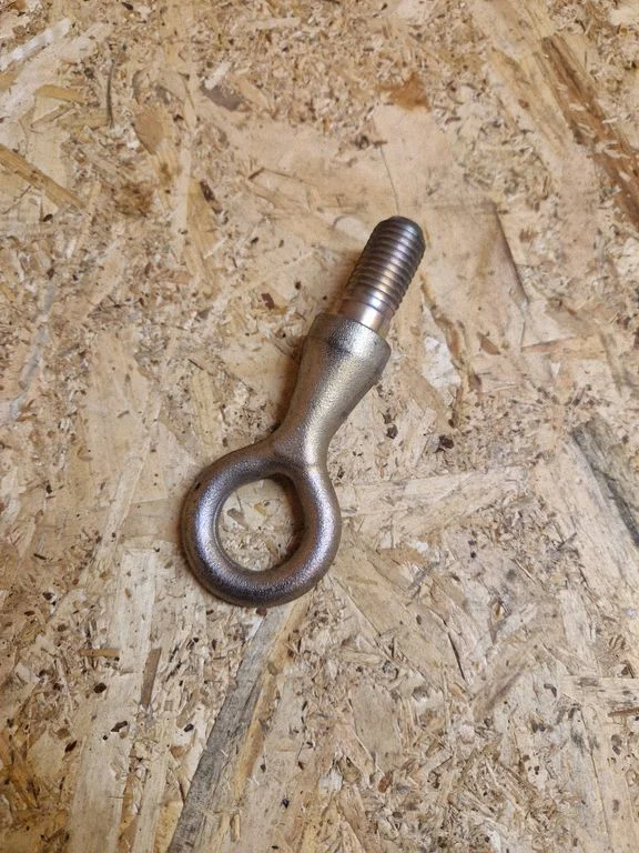 Towing hook eye