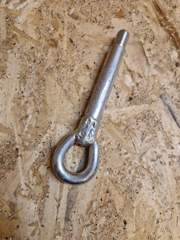 Towing hook eye