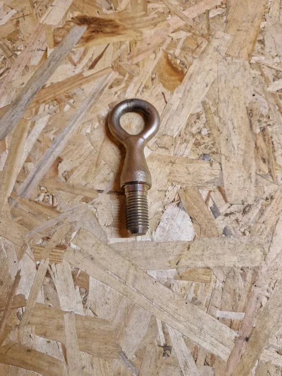 Towing hook eye