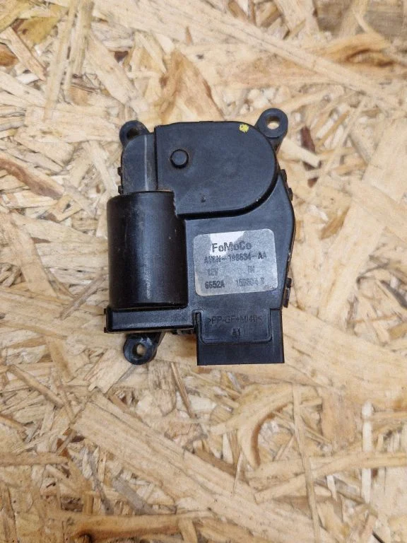 Air flap motor/actuator AV6N19B634AA