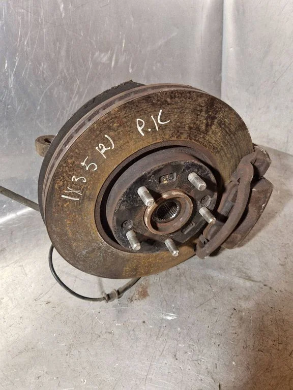Front wheel hub spindle knuckle – left