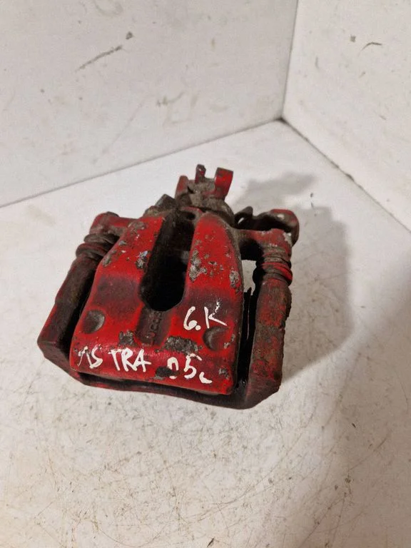 Rear brake caliper – left