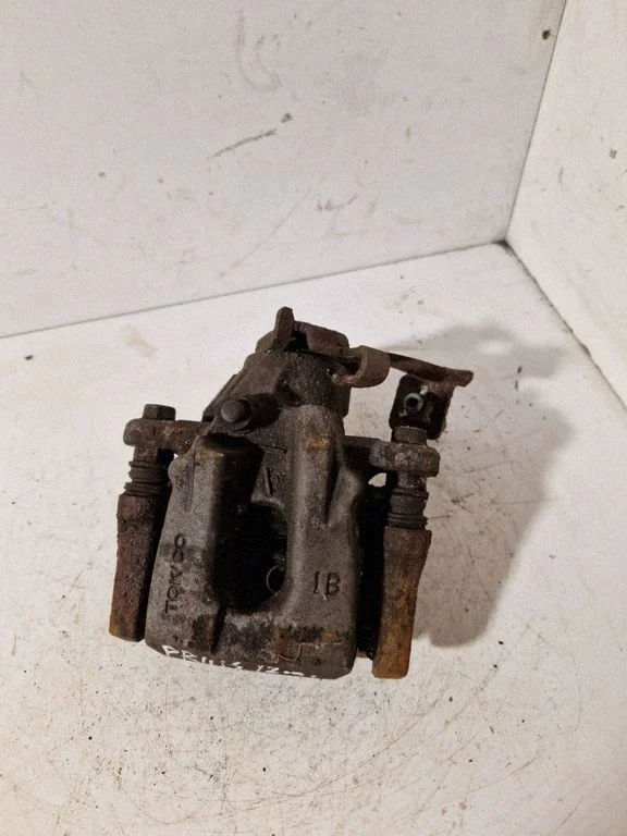 Rear brake caliper – left
