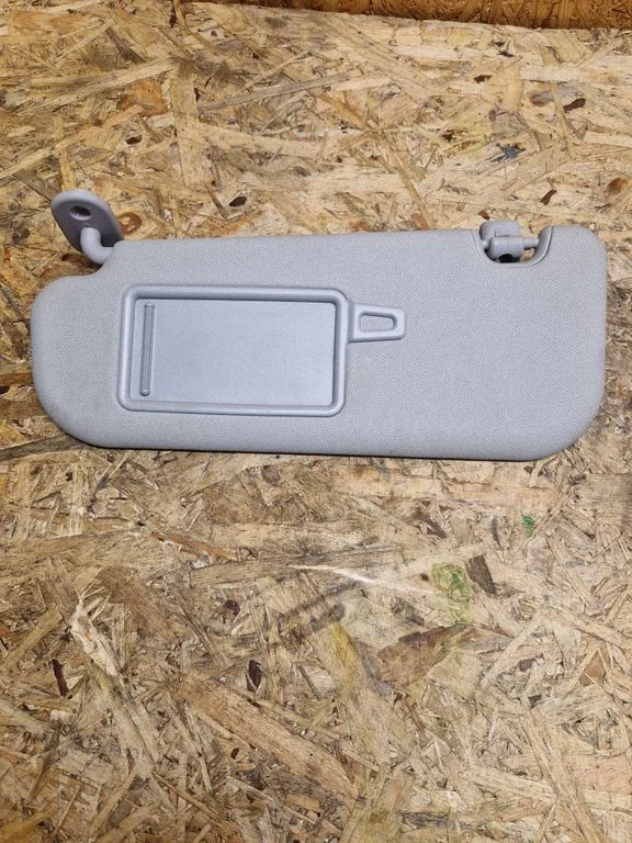 Sun visor – left