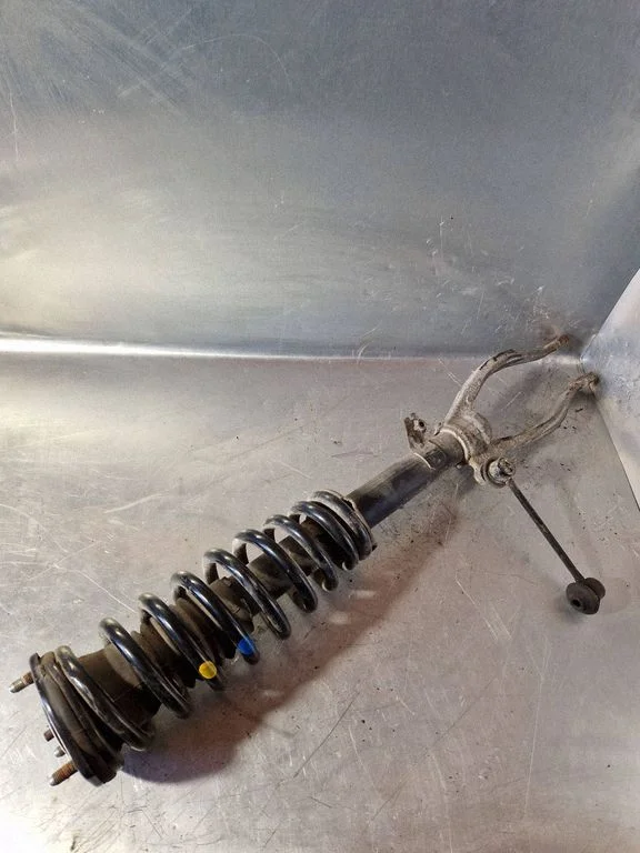 Front shock absorber with coil spring – left