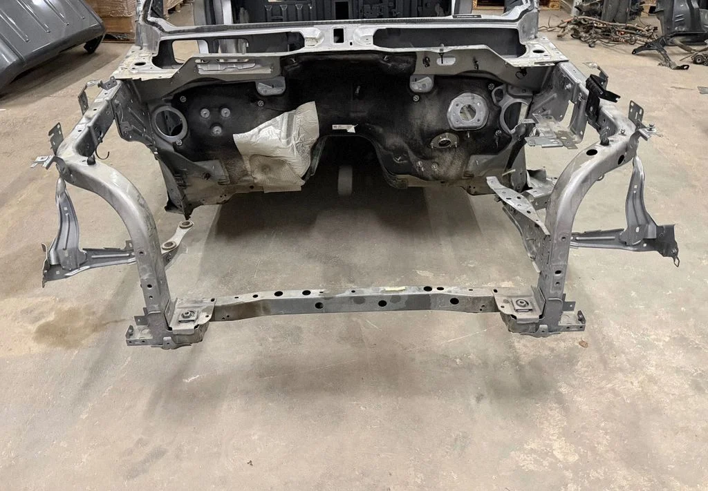 Radiator support slam panel
