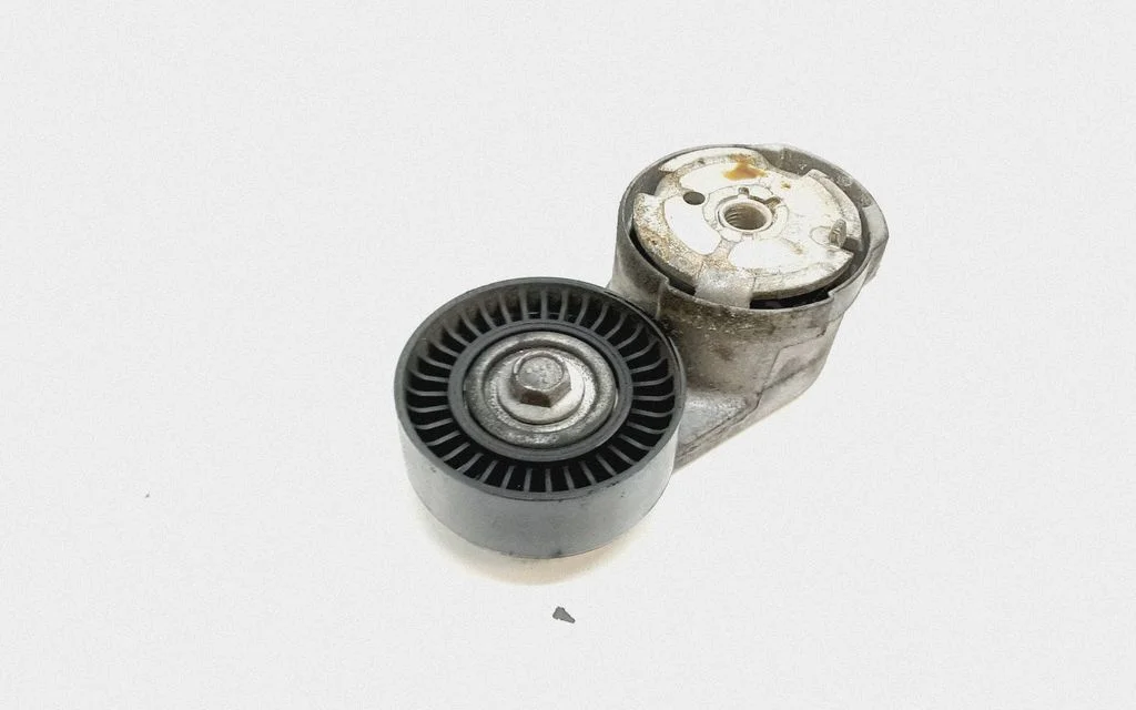 Generator/alternator belt tensioner 05184617AD