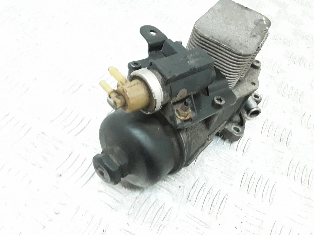 Oil filter mounting bracket – front